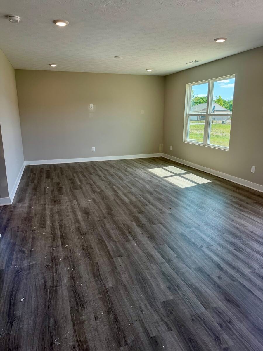 Spacious main-level living area with durable flooring and large windows